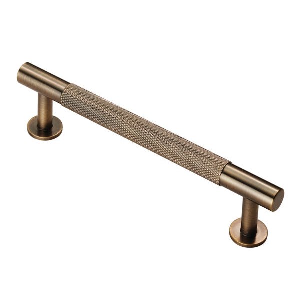 Carlisle Brass Knurled Pull Handle in a brushed bronze finish, featuring a textured grip and cylindrical ends, designed for easy handling and aesthetic appeal.