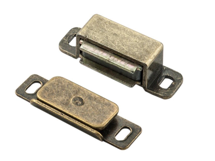 Carlisle Brass Superior Steel Magnetic Catch with a sleek design in a brass finish, featuring two components: a rectangular magnet and a metal plate, both designed for secure closure.