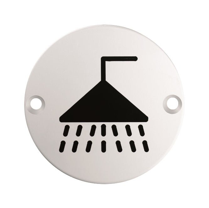 Carlisle Brass Shower Symbols in white, featuring a black shower head graphic with water streams, designed for clear bathroom labeling, suitable for use in wet environments.