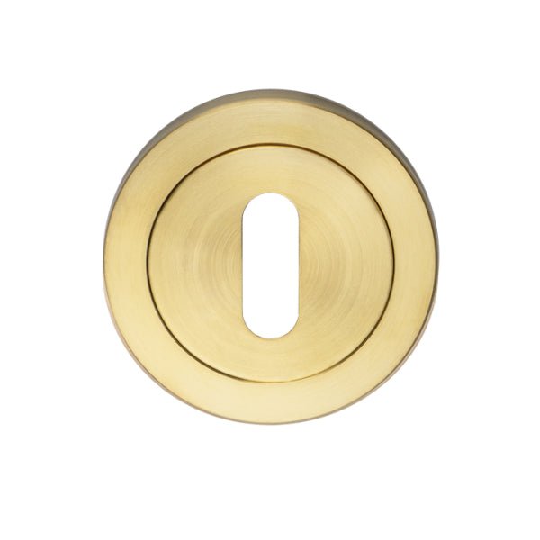 Carlisle Brass SWL Escutcheon - Standard Profile in brushed brass finish, featuring a round shape with a keyhole cutout in the center.