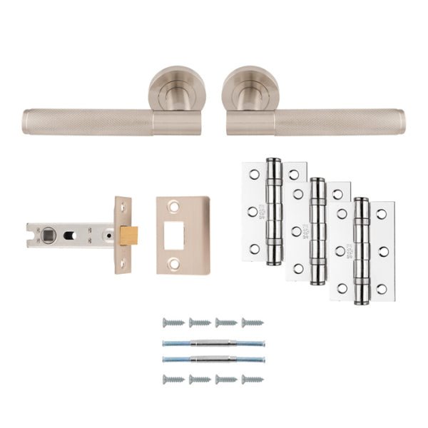 Carlisle Brass Lagos Knurled Door Handle Pack in brushed nickel, includes two lever handles, a latch, and three pairs of hinges, all featuring a knurled texture for grip, with accompanying mounting screws.