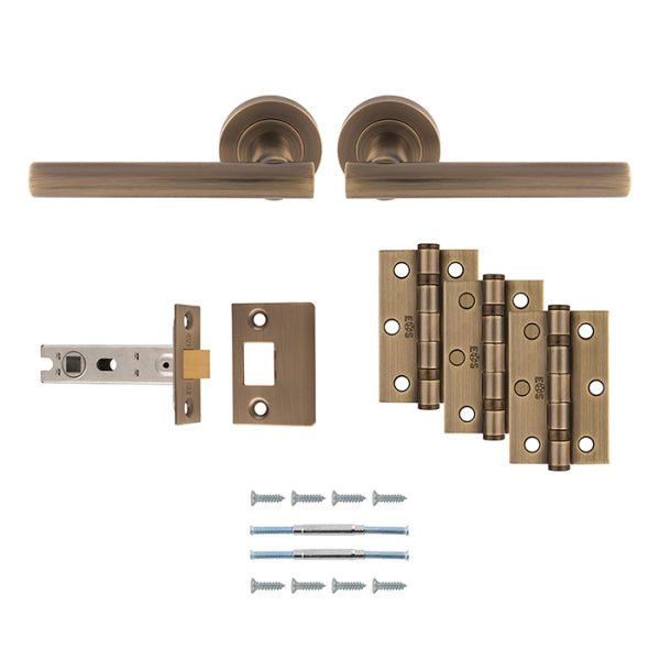 Carlisle Brass Faro Door Handle Pack in an antique bronze finish, includes lever handles, latch, and hinges. The set features two lever handles and three matching hinges, along with necessary screws for installation.