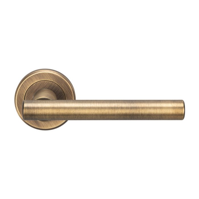 Carlisle Brass Philadelphia Lever On Rose in an antique bronze finish, featuring a cylindrical lever design and a round escutcheon plate.