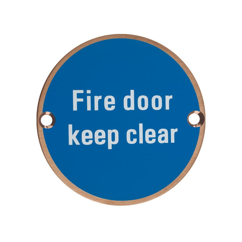 Zoo Hardware Fire Door Keep Clear Sign in blue with white lettering, featuring a circular design and two mounting holes.