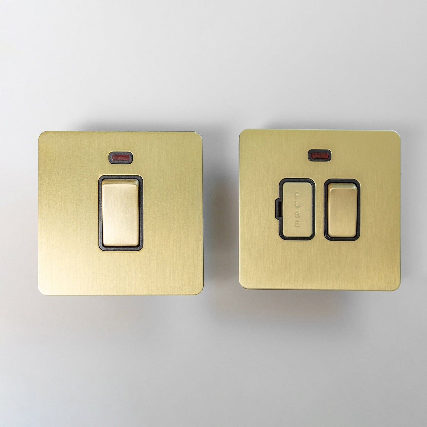Satin Brass Switches and Sockets - Straight Knurled Design