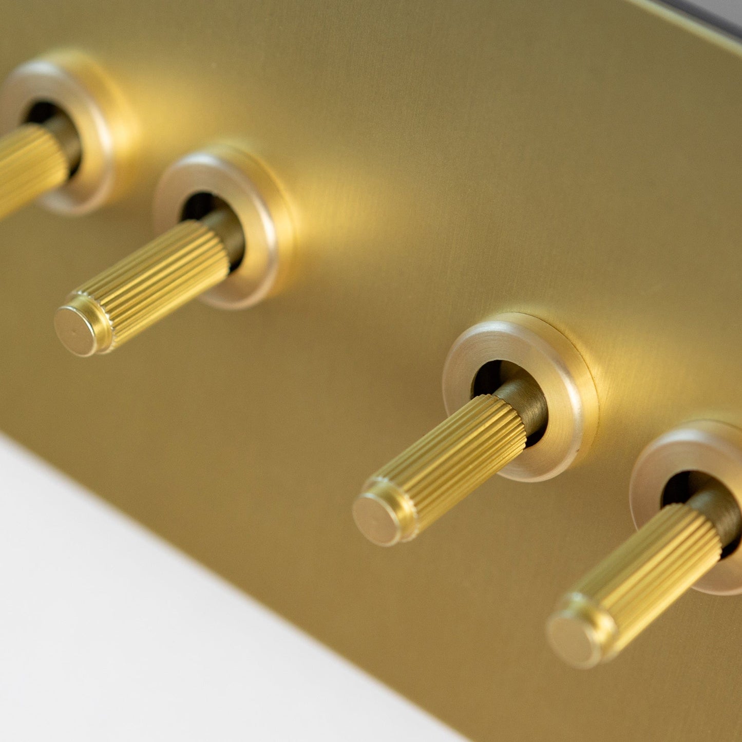 Satin Brass Switches and Sockets - Straight Knurled Design