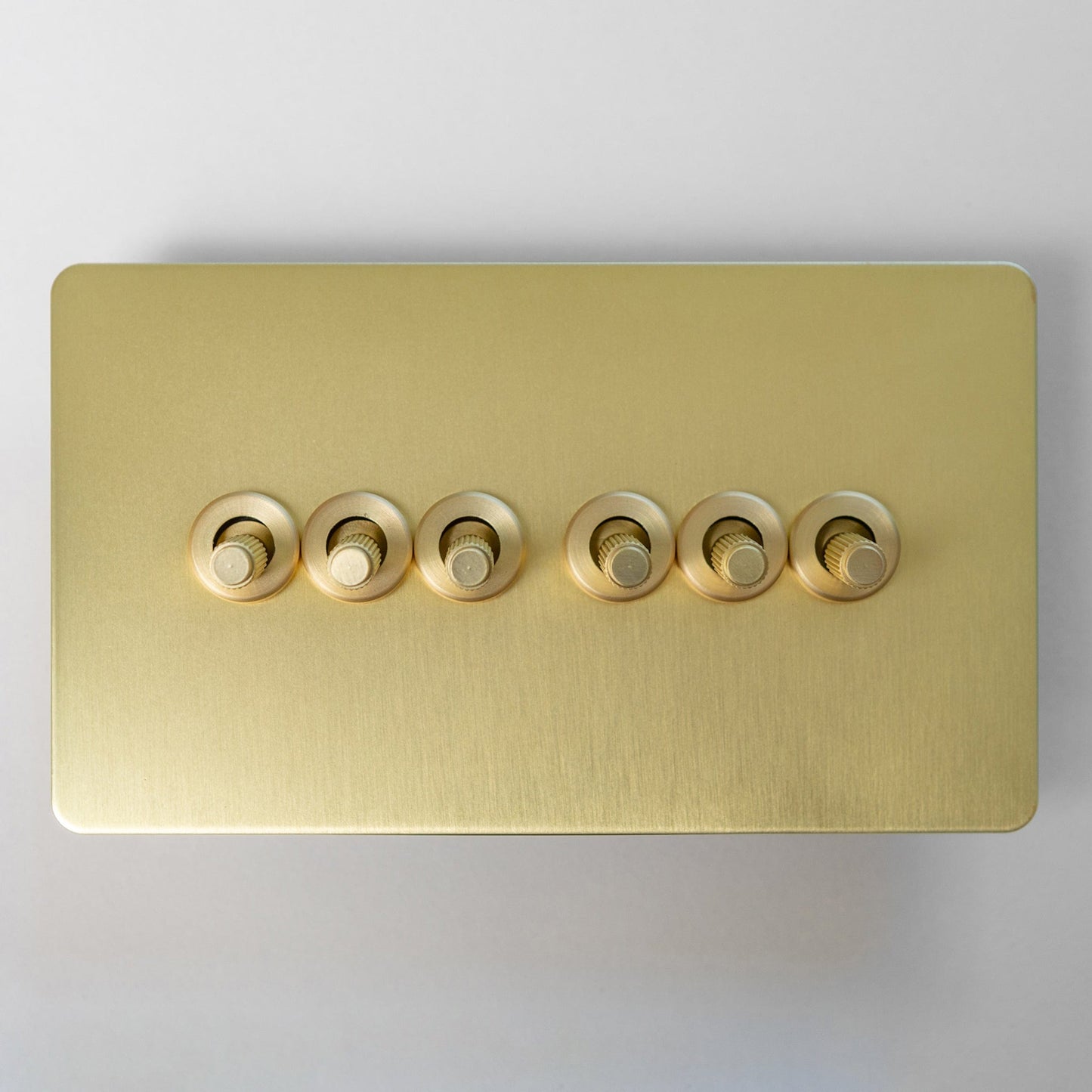 Satin Brass Switches and Sockets - Straight Knurled Design