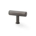 Alexander & Wilks Crispin Knurled T-Bar Cupboard Knob in a dark metallic finish, featuring a textured knurled surface for grip and a cylindrical shape, designed for cupboard doors.