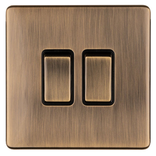 Eurolite Concealed 3mm 2 Gang Switch in antique brass finish, featuring two rectangular switches with a brushed texture, mounted on a square plate.