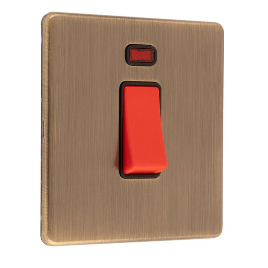 Eurolite Concealed 3mm 45Amp Switch with Neon Indicator in antique brass finish, featuring a red toggle switch and a small indicator light on the plate.