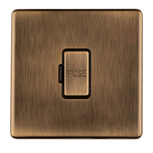 Eurolite Concealed 3mm Unswitched Fuse Spur in antique brass finish, featuring a brushed surface and a rectangular design with a central fuse switch.