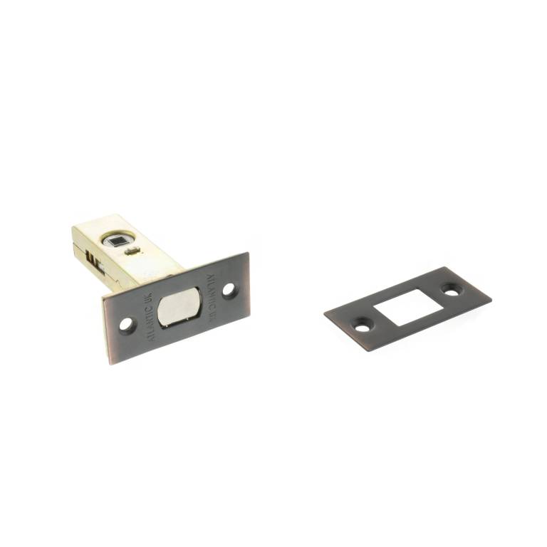 Atlantic Tubular Deadbolt – 2.5", 3" & 4" featuring a rectangular metal body with a round bolt mechanism, shown alongside a matching strike plate. The deadbolt is designed for security applications.