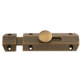 Carlisle Brass Surface Bolt in antique brass finish, featuring a sleek design with a cylindrical knob and multiple screw holes for easy installation.
