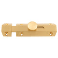 Carlisle Brass Surface Bolt in a brushed brass finish, featuring a round thumb turn and multiple mounting holes for secure installation.