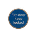Atlantic Comercial Hardware fire door sign in circular shape, featuring a blue background and white text stating "Fire door keep locked." The sign is designed for clear visibility and is made of durable materials.
