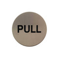 Atlantic Comercial Hardware pull sign in brushed stainless steel finish, featuring bold black lettering on a round surface.