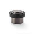 Alexander & Wilks Plain Floor Mounted Door Stop featuring a cylindrical base with a metallic finish and a black rubber ring, designed to provide sturdy door protection and prevent wall damage.