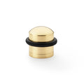 Alexander & Wilks Dome Top Floor Mounted Door Stop in brass with a smooth rounded top and a black rubber base for added grip.