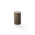 Alexander & Wilks Brunel Knurled Cupboard Knob featuring a cylindrical shape with a textured knurled pattern in dark color, finished with gold accents around the top and bottom edges.