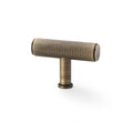 Alexander & Wilks Crispin Knurled T-Bar Cupboard Knob in antique brass, featuring a textured handle and a cylindrical base, designed for cabinet or drawer installation.