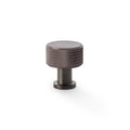 Alexander & Wilks Lucia Knurled Cupboard Knob in dark bronze finish, featuring a round top with textured detailing and a cylindrical post base, designed for cabinet and drawer applications.