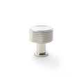 Alexander & Wilks Lucia Knurled Cupboard Knob in polished chrome finish, featuring a textured knurled design on the top and a round base, designed for use on cabinetry and furniture.