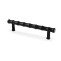 Alexander & Wilks Crispin Bamboo T-Bar Cupboard Pull Handle in black, featuring a textured, wavy design for grip and two cylindrical mounting posts.