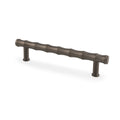 Alexander & Wilks Crispin Bamboo T-Bar Cupboard Pull Handle in a dark bronze finish, featuring a textured, bamboo-inspired design and two posts for mounting.