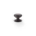 Alexander & Wilks Waltz Round Cupboard Knob on Stepped Rose in a dark bronze finish, featuring a round design and stepped base for easy grip, suitable for cabinets and drawers.