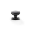 Alexander & Wilks Waltz Round Cupboard Knob on Stepped Rose in a matte black finish, featuring a rounded top and a stepped base for secure mounting.