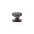Alexander & Wilks Waltz Round Cupboard Knob on Stepped Rose in an oil-rubbed bronze finish, featuring a rounded knob design on a stepped base, suitable for cabinetry and furniture.