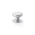 Alexander & Wilks Waltz Round Cupboard Knob on Stepped Rose in a brushed satin finish, featuring a smooth, rounded design and a stepped base for easy grip.