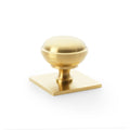 Alexander & Wilks Quantock Cupboard Knob on Square Backplate in brushed brass, featuring a round knob design mounted on a square backplate for cabinet or furniture installation.