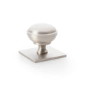 Alexander & Wilks Quantock Cupboard Knob on Square Backplate features a round brushed nickel knob atop a square backplate, both designed with a smooth finish and simple cylindrical shape.