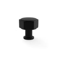 Alexander & Wilks Vesper Hex Cabinet Knob in black, featuring a hexagonal design with a smooth top surface and a cylindrical base, made of durable metal.
