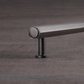 Alexander & Wilks Vesper Hex T-Bar Cabinet Pull in a sleek metal finish, featuring a horizontal bar shape with rounded end caps and a center support, designed for modern cabinetry.