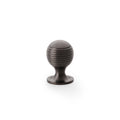 Alexander & Wilks Caesar Cupboard Knob on Round Rose in a dark finish, featuring a ridged round design and a smooth rounded top, suitable for cabinet or cupboard installation.