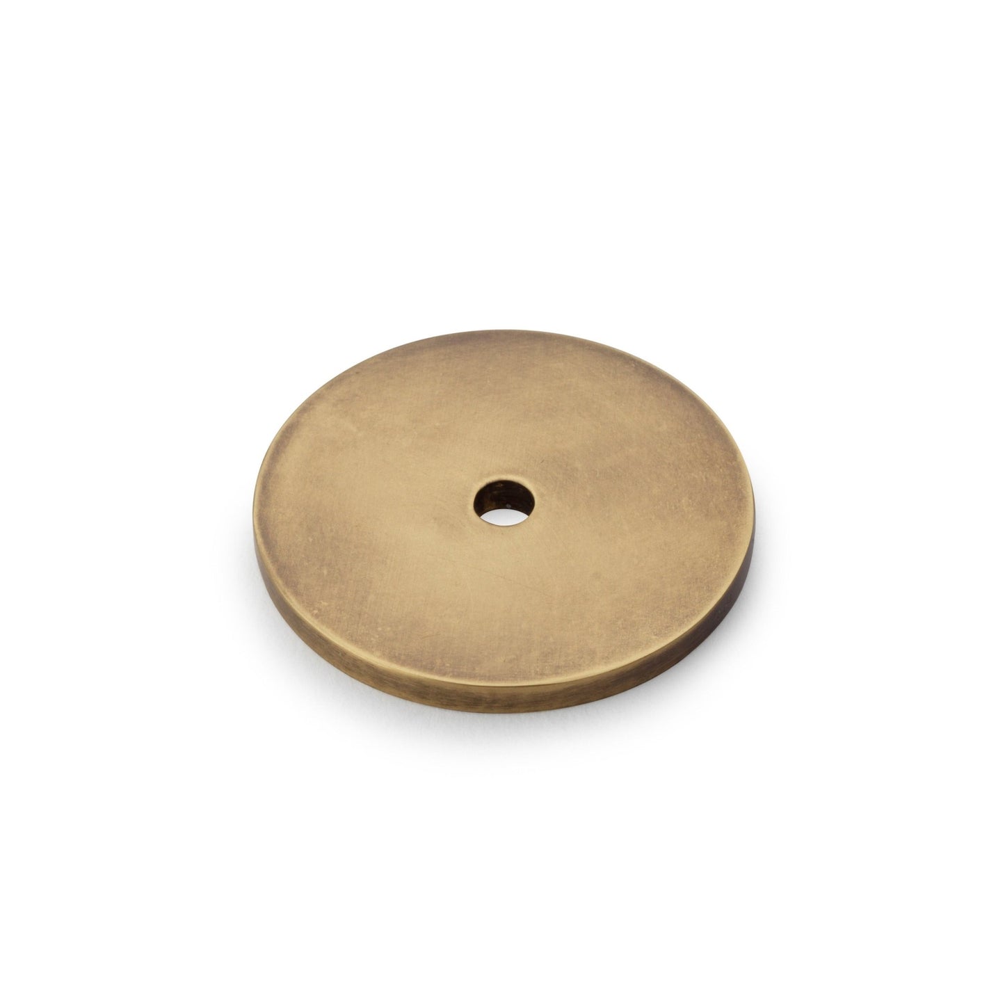 Alexander & Wilks Circular Backplate in a brushed brass finish, featuring a round design with a central hole for mounting. The plate offers a smooth surface and simple, functional shape suitable for various lighting fixtures.