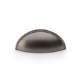 Alexander & Wilks Quieslade Cup Handle in a dark metallic finish, featuring a curved design that resembles a half dome, suitable for drawers and cabinets.