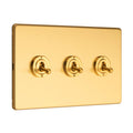 Eurolite Stainless Steel 3 Gang Toggle Switch in satin brass finish, featuring three toggle switches with round bases on a rectangular plate.