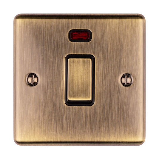 Eurolite Enhance Decorative 20Amp Switch with Neon Indicator in antique finish, featuring a rectangular toggle switch and a small red indicator light above, all mounted on a brushed metal plate.