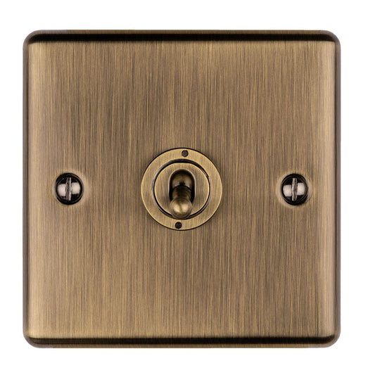 Eurolite Enhance Decorative 1 Gang Toggle Switch in antique finish, featuring a round toggle switch centered within a square metal plate with a brushed texture and two screws for installation.