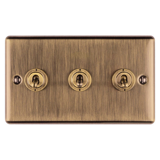 Eurolite Enhance Decorative 3 Gang Toggle Switch in antique finish, featuring three toggle switches with a brushed bronze texture and round switch caps.
