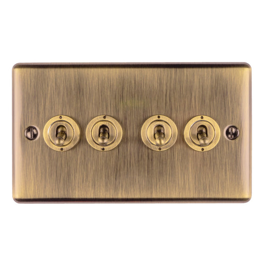 Eurolite Enhance Decorative 4 Gang Toggle Switch in antique finish, featuring four toggle switches mounted on a brushed brass metal plate, suitable for electrical applications.
