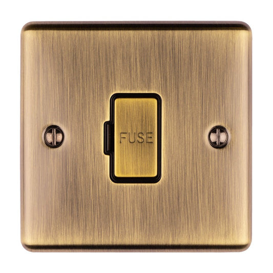 Eurolite Enhance Decorative Unswitched Fuse Spur in antique finish, featuring a rectangular metal plate with a central fuse switch and two mounting screws.