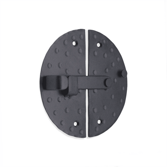 Spira Brass Marvel Cabinet Lock in black finish, featuring an oval shape with a textured surface and a sliding latch mechanism, designed for secure cabinet closure.