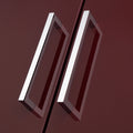 Carlisle Brass Block Handle with a polished chrome finish, featuring a rectangular design, shown mounted on a dark red surface.