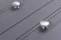 Carlisle Brass Oxford Knob in brushed nickel finish, featuring a smooth rounded design suitable for cabinetry, shown on a gray panel surface.