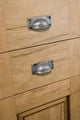 Carlisle Brass Square Plate Cup Handle measuring 79 x 25 mm, featured in a brushed nickel finish, mounted on wooden drawers with a natural oak appearance.
