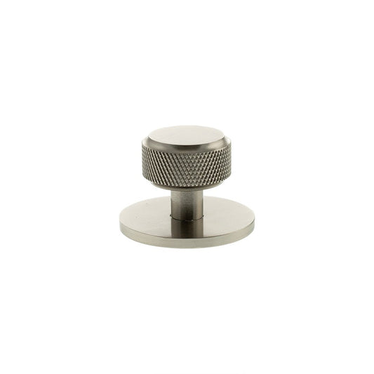 Atlantic Millhouse Brass Eiffel Knurled Round Cabinet Knob Handle on Backplate in a brushed brass finish, featuring a knurled texture on the knob and a round backplate for mounting.